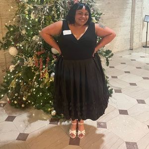 Elegant & fun black dress with ruffled petals on bottom!